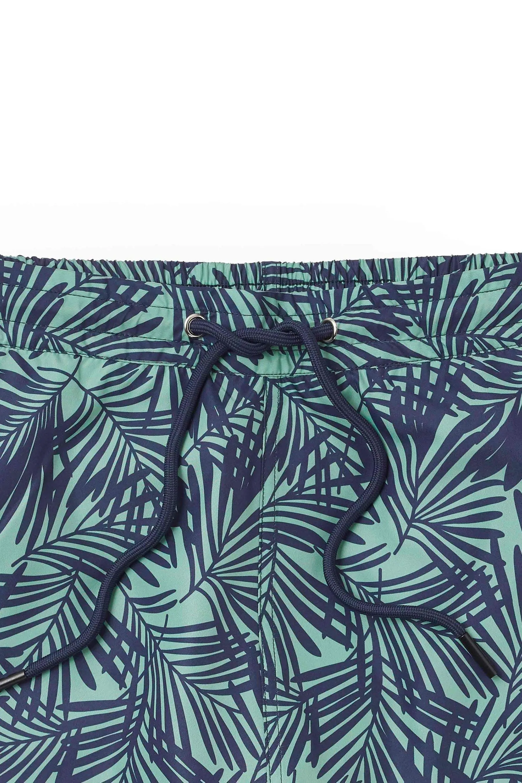 The Savile Row Company Verde - Shorts da bagno blu navy in tessuto riciclato con palme Stampa    